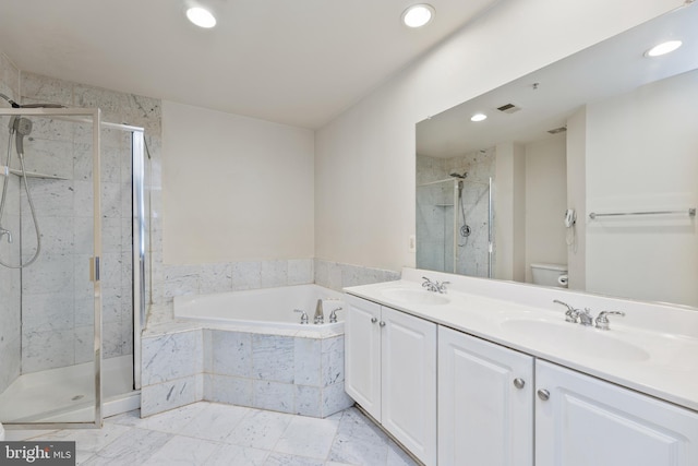 full bath featuring a garden tub, a sink, a shower stall, and toilet