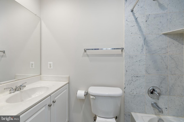 bathroom featuring bathtub / shower combination, vanity, and toilet