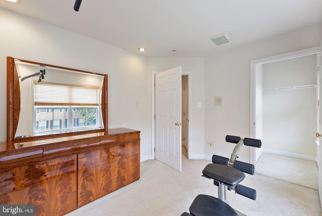 exercise area with light carpet, recessed lighting, and baseboards