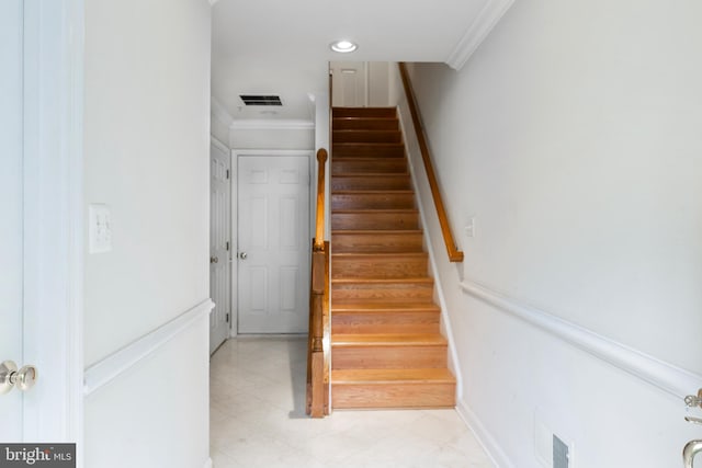 stairs with baseboards, visible vents, crown molding, and recessed lighting