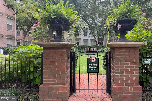 view of gate with fence