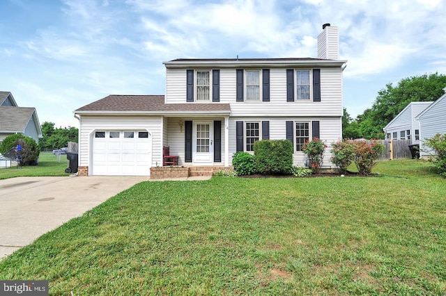 view of front of home featuring a front yard and a garage