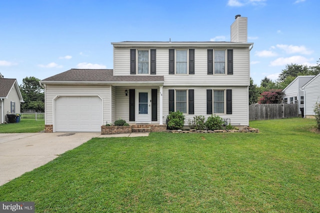 view of front facade featuring a garage and a front lawn