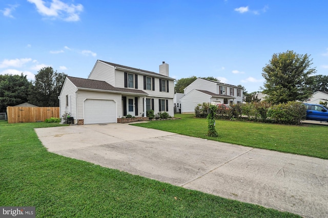 view of front facade featuring a front yard and a garage