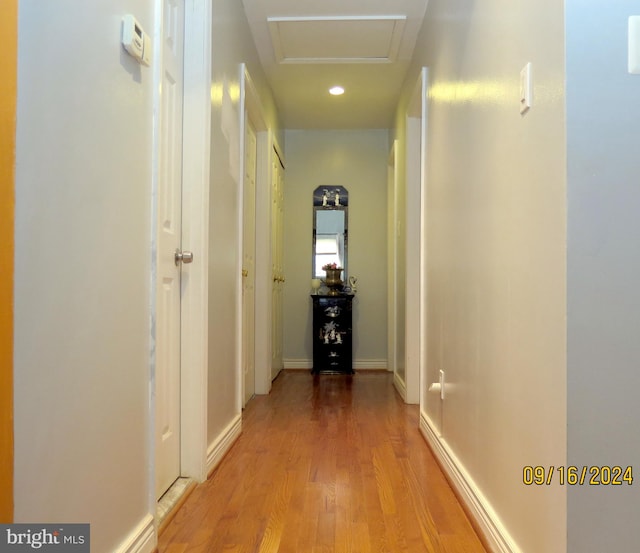 hall with light hardwood / wood-style floors