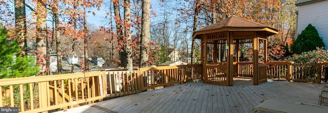 wooden terrace featuring a gazebo