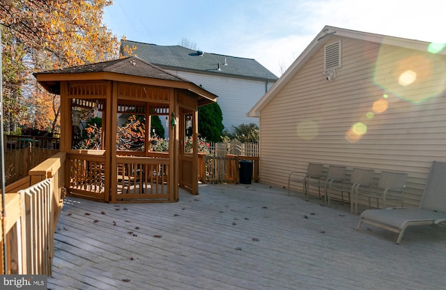 wooden terrace with a gazebo