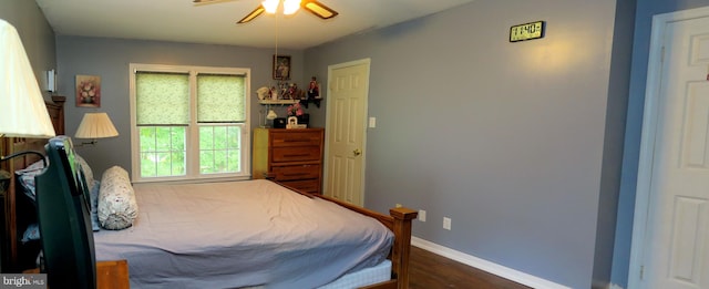 bedroom featuring ceiling fan and dark hardwood / wood-style floors