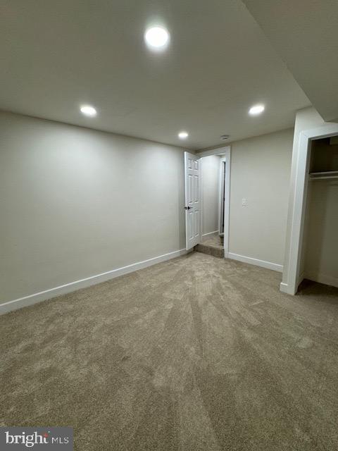 interior space featuring carpet floors, baseboards, and recessed lighting