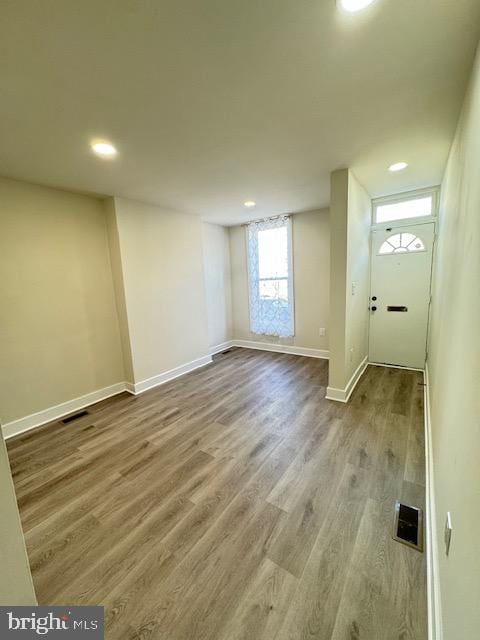 bonus room with hardwood / wood-style floors