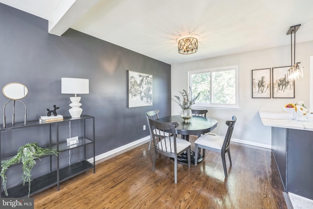 dining space featuring dark hardwood / wood-style floors