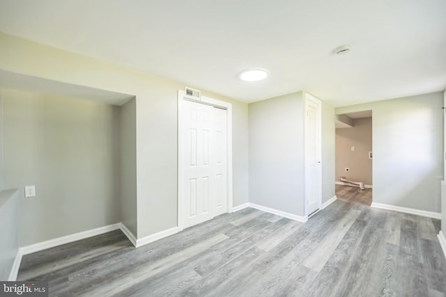 spare room with hardwood / wood-style flooring