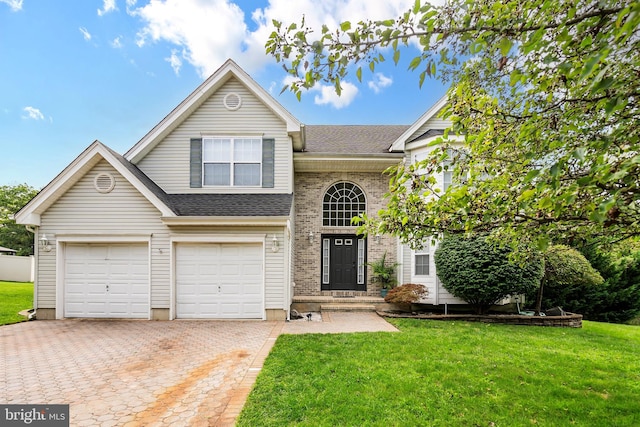 front of property with a front yard and a garage