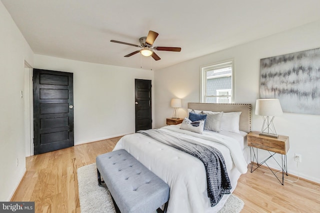 bedroom featuring light hardwood / wood-style flooring and ceiling fan