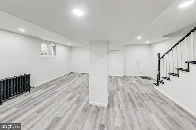 basement featuring light hardwood / wood-style floors