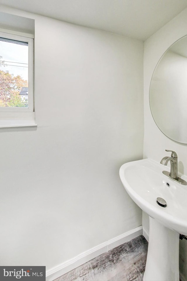 bathroom featuring sink and hardwood / wood-style floors