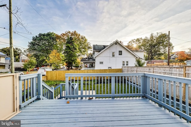 wooden terrace with a yard