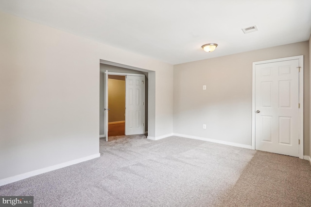 empty room with light colored carpet