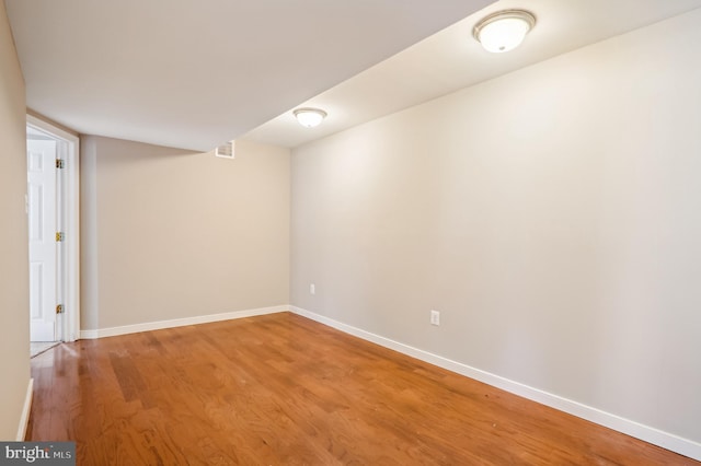 empty room featuring wood-type flooring