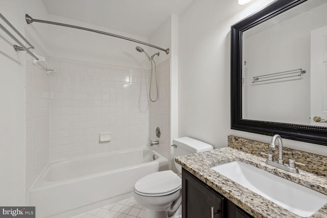 full bathroom with vanity, toilet, tiled shower / bath combo, and tile patterned floors