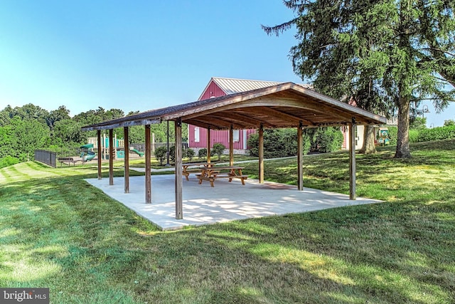 surrounding community featuring a lawn, a gazebo, and a playground