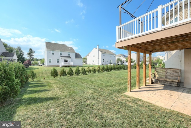 view of yard with a patio area and a deck