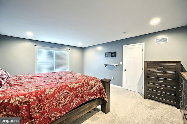 bedroom with light colored carpet