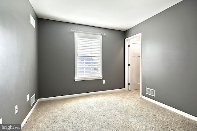 empty room featuring carpet floors