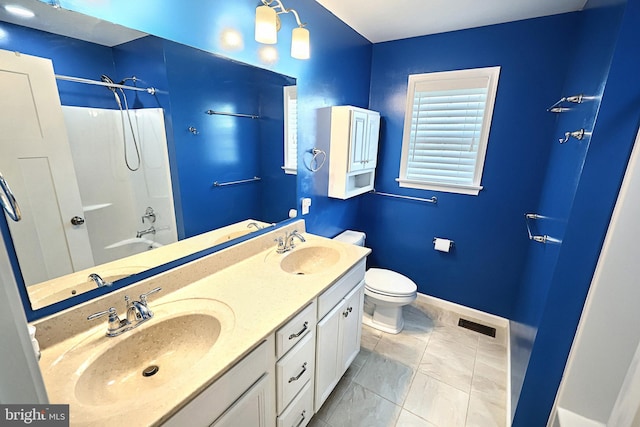 full bathroom featuring vanity, toilet, and shower / tub combination