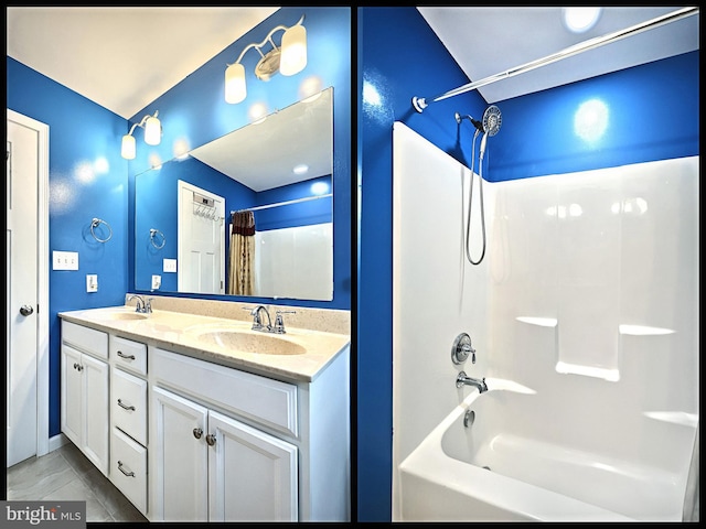 bathroom featuring vanity and shower / tub combo with curtain