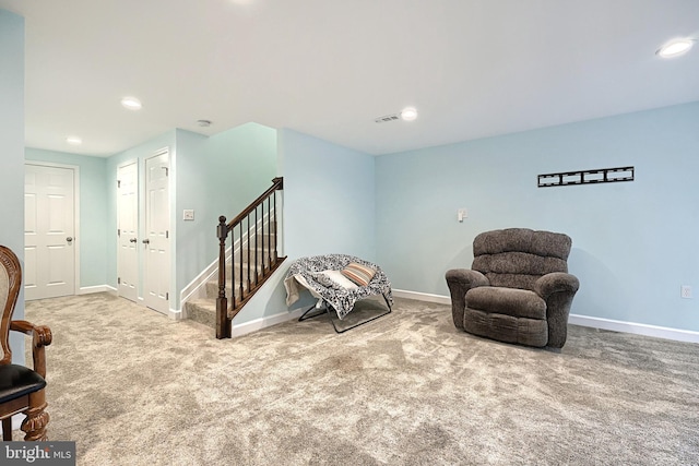 sitting room with carpet floors