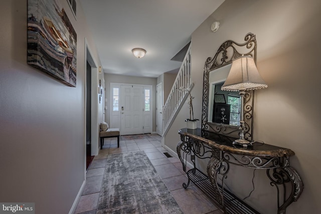 entrance foyer featuring tile patterned floors