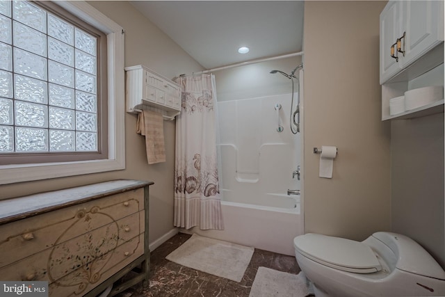 full bathroom with shower / bath combo, vanity, and toilet