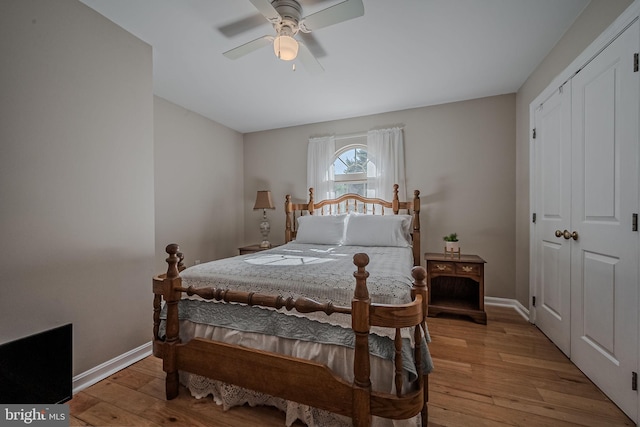 bedroom featuring a closet, light wood-type flooring, and ceiling fan