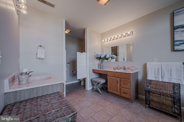 bathroom with tile patterned flooring and vanity