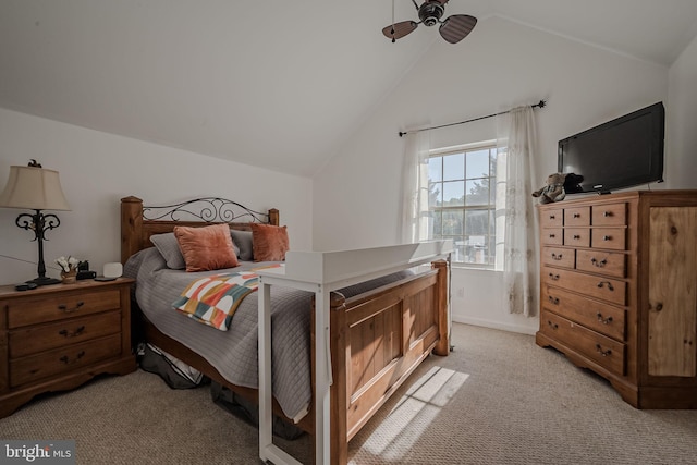 bedroom featuring ceiling fan, light colored carpet, and lofted ceiling