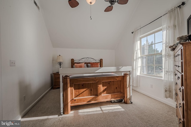 carpeted bedroom featuring ceiling fan and vaulted ceiling