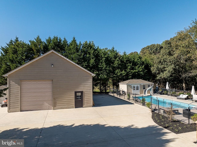 garage featuring a fenced in pool