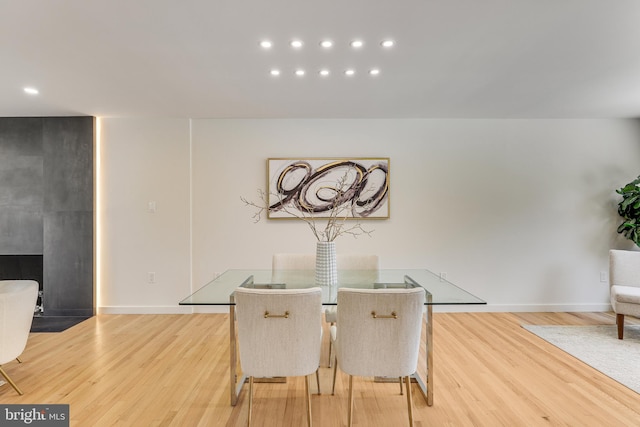 dining space with light hardwood / wood-style floors