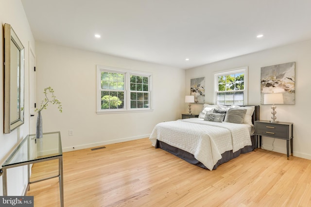 bedroom with light hardwood / wood-style floors