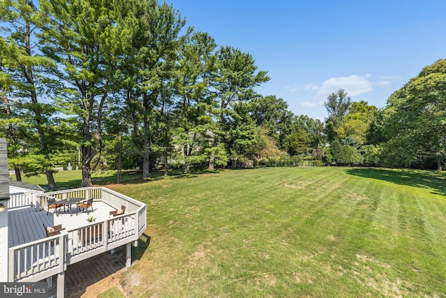 view of yard featuring a wooden deck