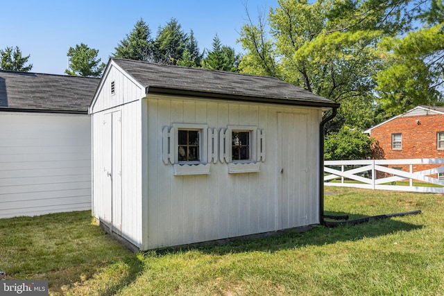 view of outdoor structure with a lawn