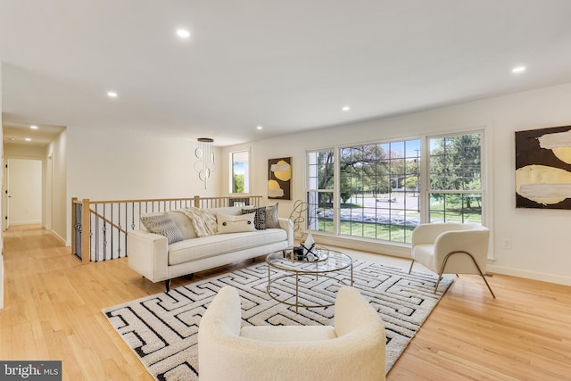 living room with light hardwood / wood-style flooring