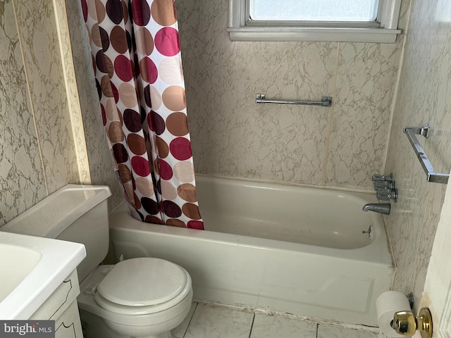 full bathroom featuring tile patterned floors, shower / bathtub combination with curtain, vanity, and toilet