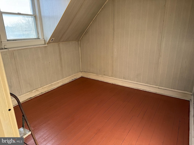 additional living space featuring hardwood / wood-style flooring