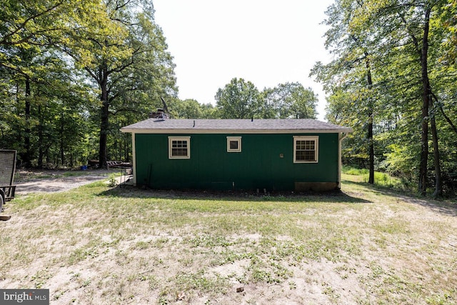 view of property exterior with a yard