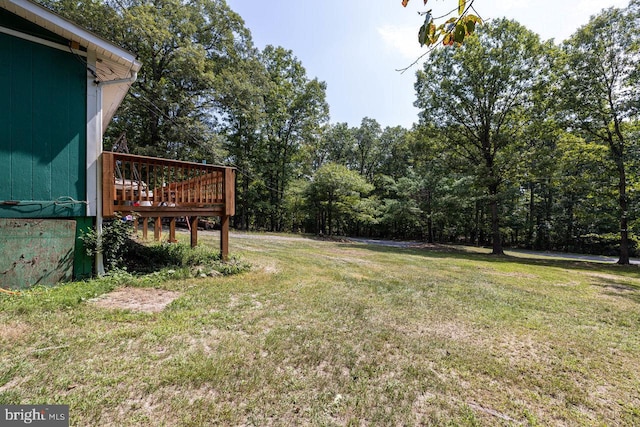 view of yard with a wooden deck