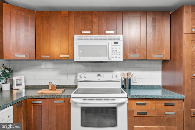 kitchen with white appliances and decorative backsplash