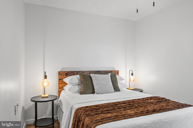 bedroom with wood-type flooring