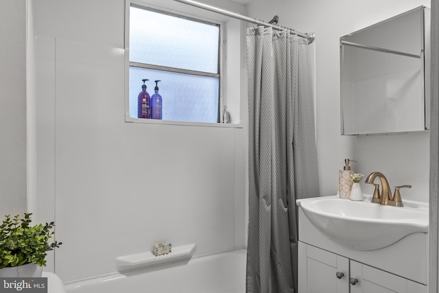 full bathroom featuring vanity, toilet, and shower / bath combo with shower curtain